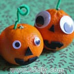Oranges making Halloween pumpkins