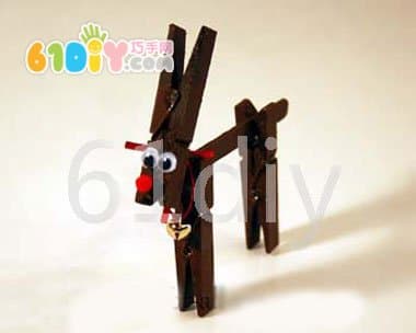 Cute Christmas reindeer making a clothespin