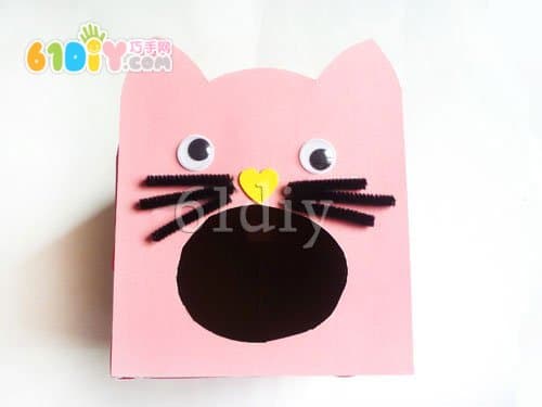 Carton handmade kitten eating fish