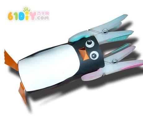 Child hand made paper tube little penguin