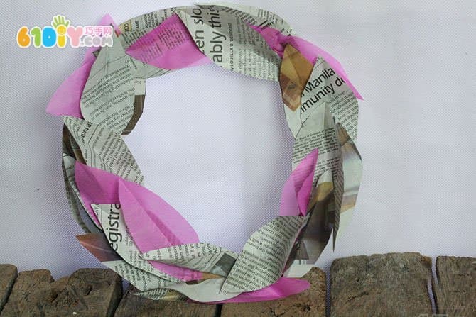 Newspaper waste utilization making wreath