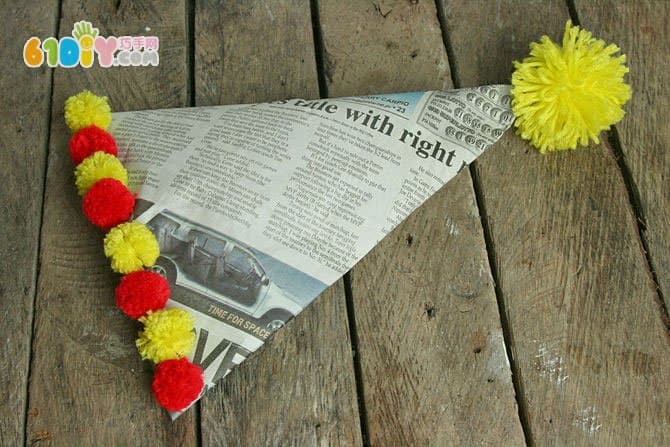 Waste newspaper making conical hat