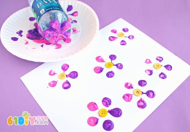 Baby painting with a bottle of beautiful flowers