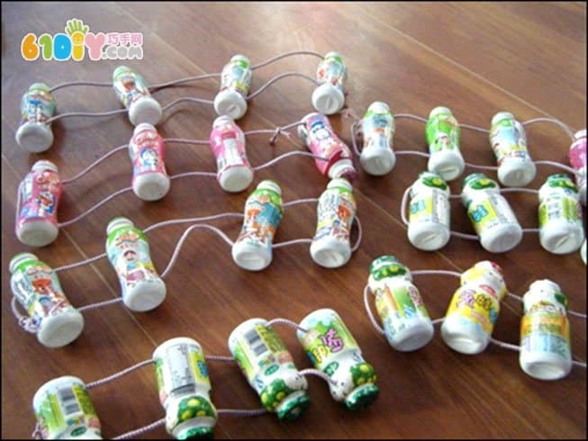 Homemade play teaching aids Yogurt bottle making puller