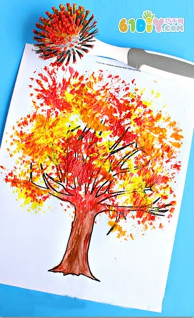 Children's drawing, draw a picture of the autumn tree with a dishwashing brush