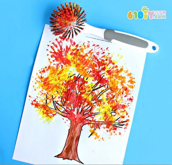 Children's drawing, draw a picture of the autumn tree with a dishwashing brush