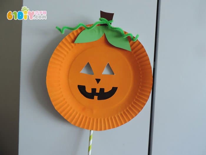 Halloween children making pumpkin man mask