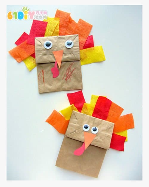 Toddler making Thanksgiving paper bag turkey