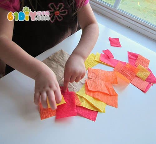 Toddler making Thanksgiving paper bag turkey