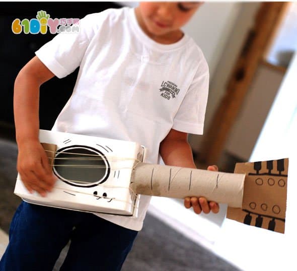 Children's creative DIY waste carton paper tube making guitar