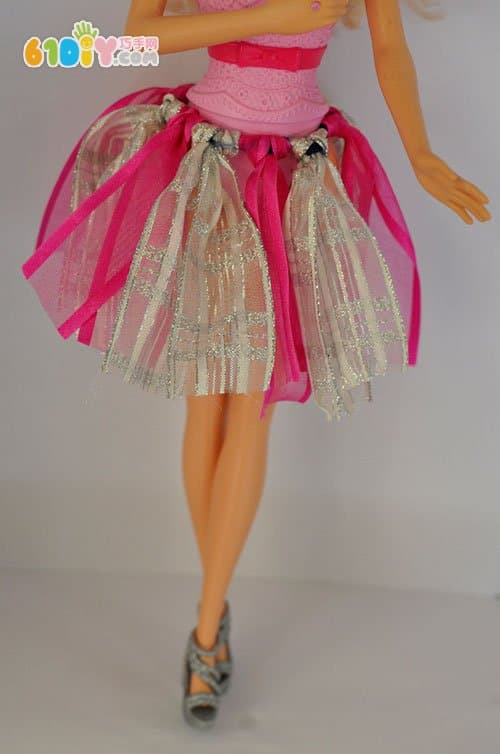 Little girl handmade make a beautiful dress for Barbie
