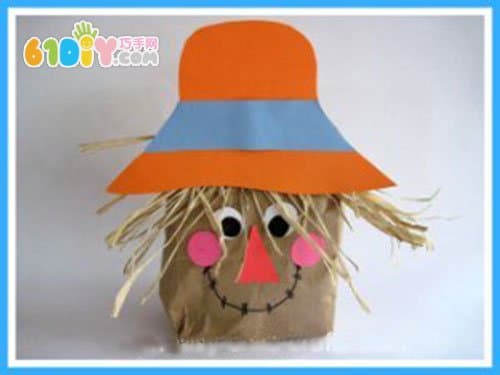 Children use waste paper bags to make scarecrow