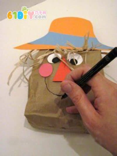 Children use waste paper bags to make scarecrow