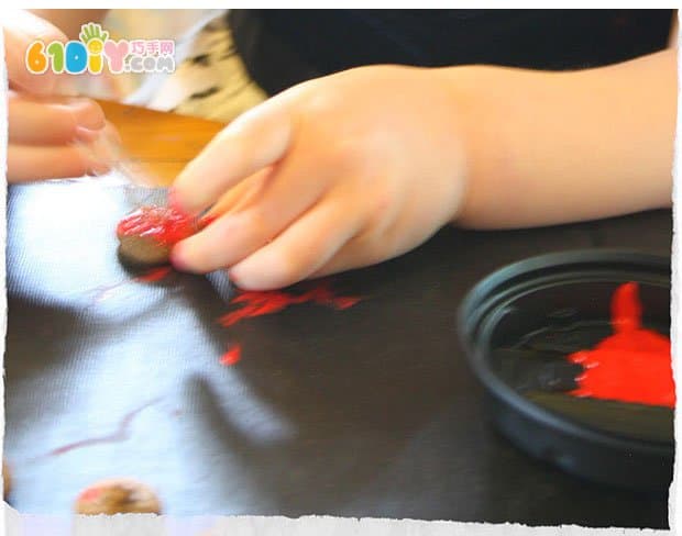 Young children use acorns to make small mushrooms