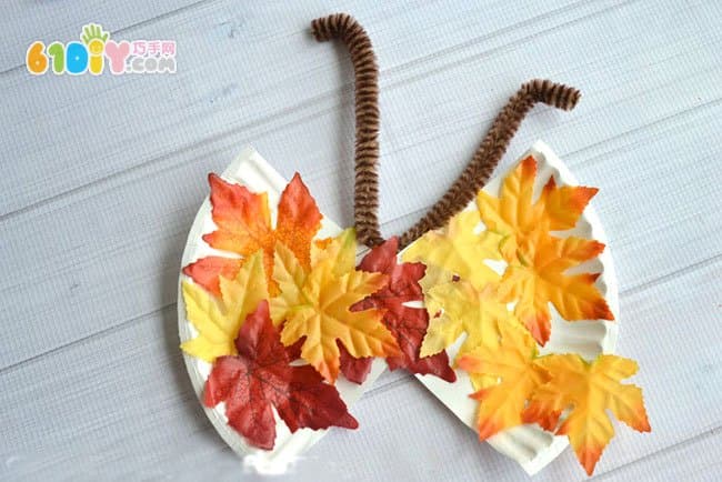 Children's autumn handmade butterfly made with leaves paper plate