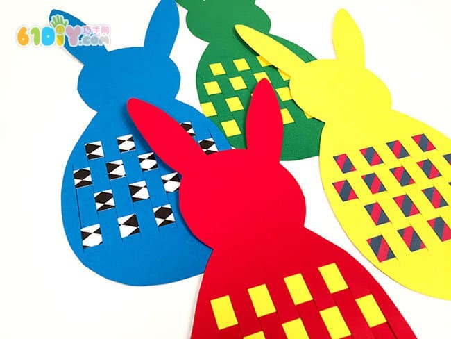 Children making simple paper rabbits