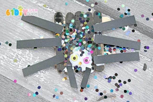 Halloween children making ice cream stick spider