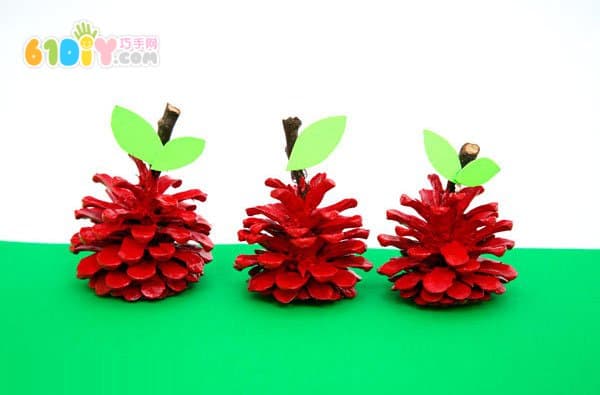 Child autumn handmade pine cone making apple