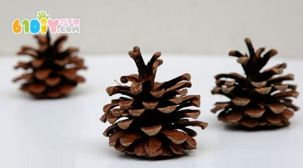 Child autumn handmade pine cone making apple
