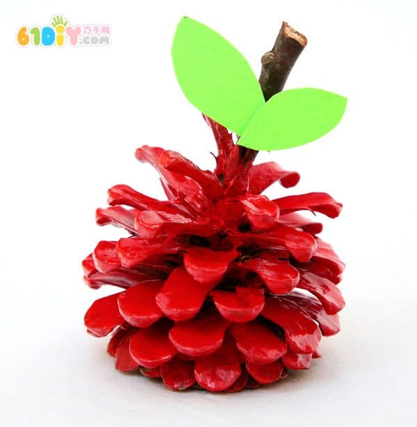 Child autumn handmade pine cone making apple