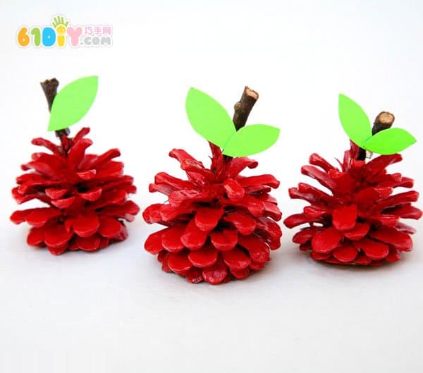 Child autumn handmade pine cone making apple