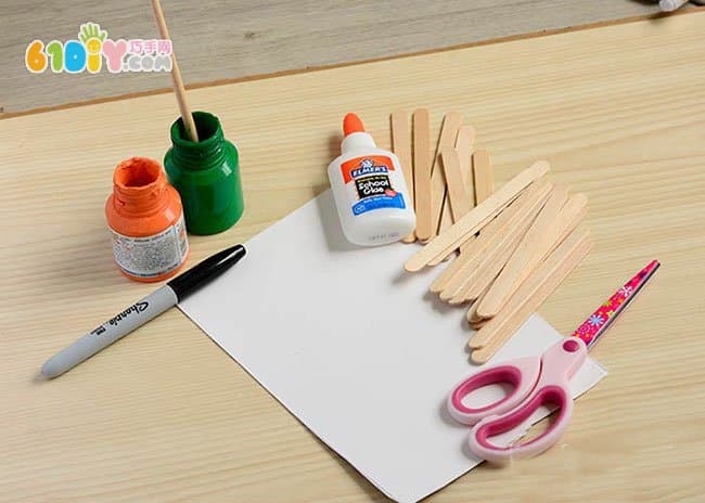 Children making Halloween pumpkins with ice cream sticks