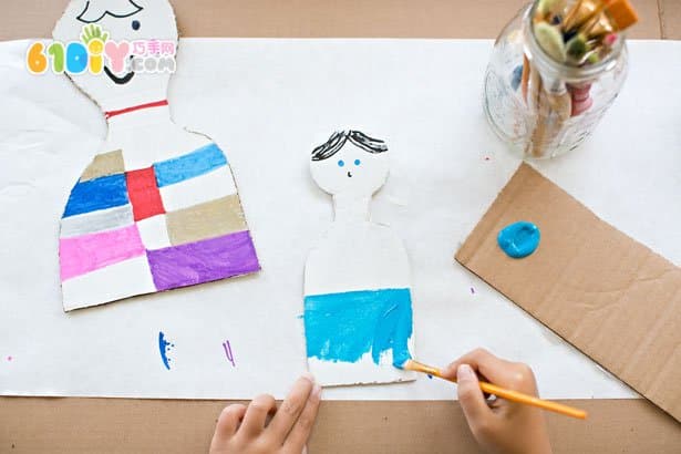 Kids waste making cardboard dolls