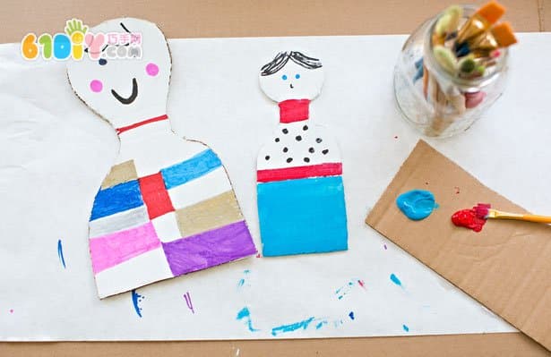 Kids waste making cardboard dolls