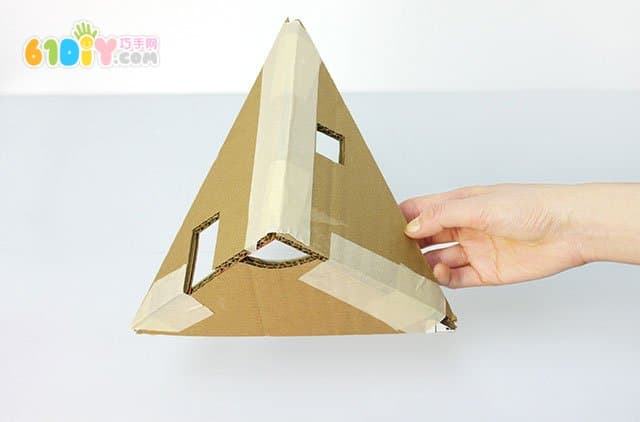 Waste cardboard DIY Christmas tree shaped dolls house