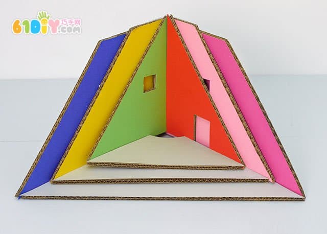 Waste cardboard DIY Christmas tree shaped dolls house