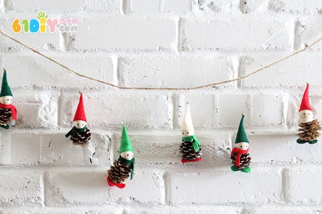 Making Christmas Elf ornaments with pine cones