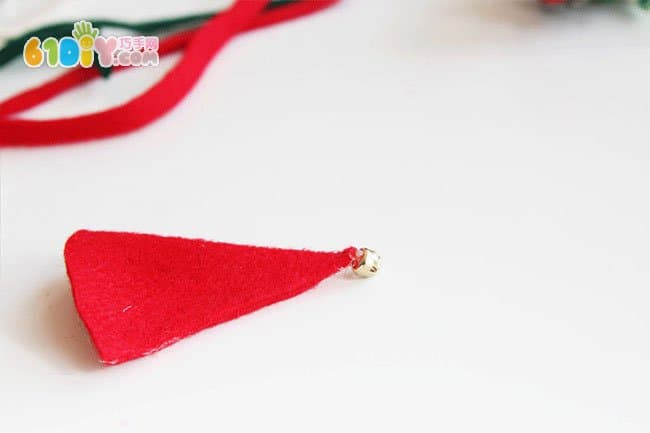 Making Christmas Elf ornaments with pine cones