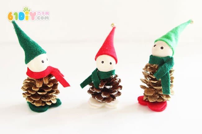 Making Christmas Elf ornaments with pine cones