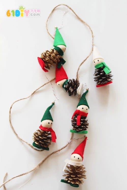 Making Christmas Elf ornaments with pine cones