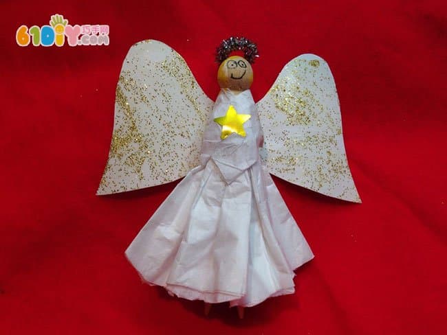 Children making wooden angels with wooden clips