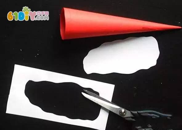 Children making cute three-dimensional paper art Santa Claus