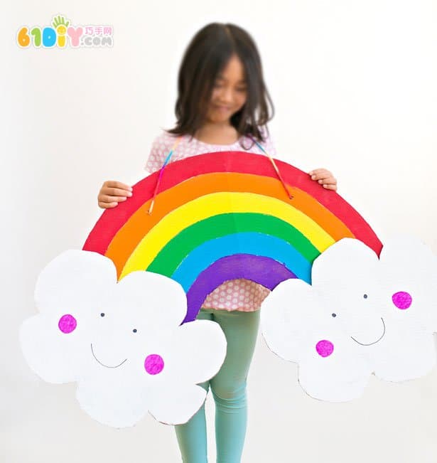 Large handmade waste cardboard making rainbow clouds