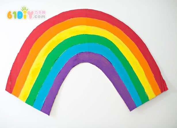 Large handmade waste cardboard making rainbow clouds