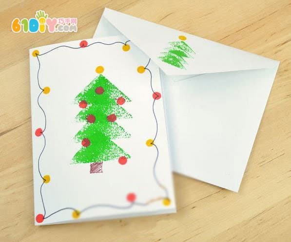 Toddler making beautiful seal Christmas tree greeting card