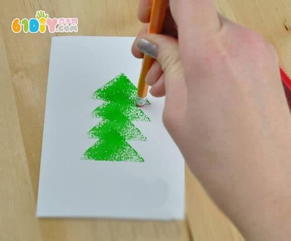 Toddler making beautiful seal Christmas tree greeting card