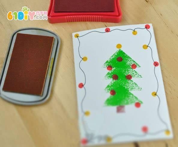 Toddler making beautiful seal Christmas tree greeting card