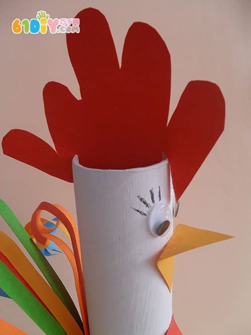 Children make big cocks using paper rolls