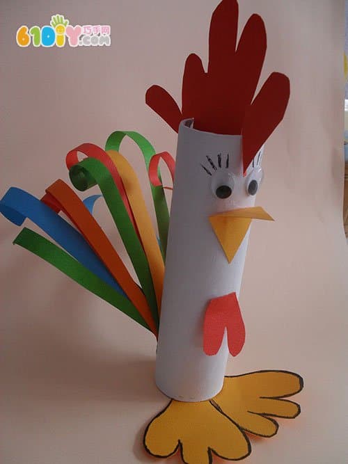 Children make big cocks using paper rolls