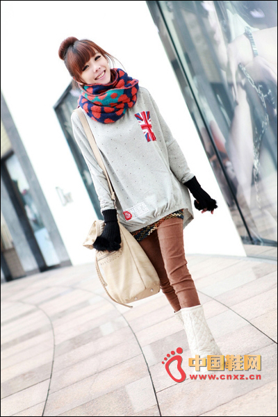 Gray-backed, rectangle-shaped sweater with a pattern of undersized flags