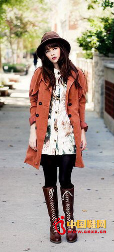 Orange-red jacket with strappy boots accentuates punk style