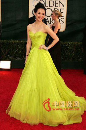 A pale yellowish green dress with a long skirt looks very elegant