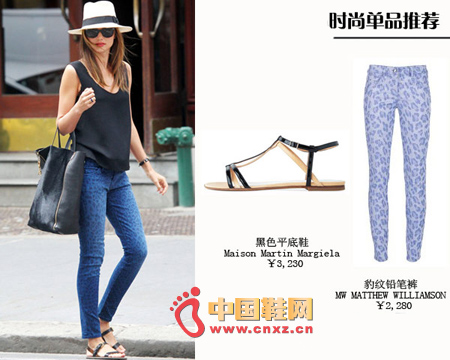 White jazz hat, black vest, blue leopard pencil pants with black flats