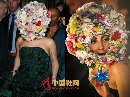Lady Gaga wearing a flower crown to help Philip Treacy show