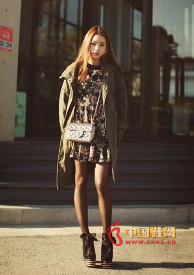 Military green long trench coat jacket with floral dress, black stockings and thick boots