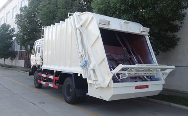 Garbage compression vehicle